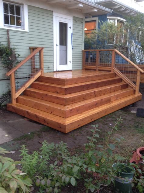 The stair railing from home is greater than a simple solution to get from the floor to a new. Cedar deck with hog panel railing | Deck Masters, LLC