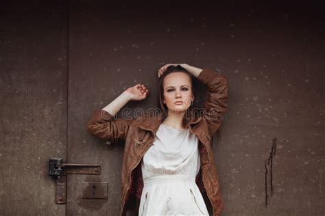 Portrait Of Fashion Model Girl On The Industrial Background Stock
