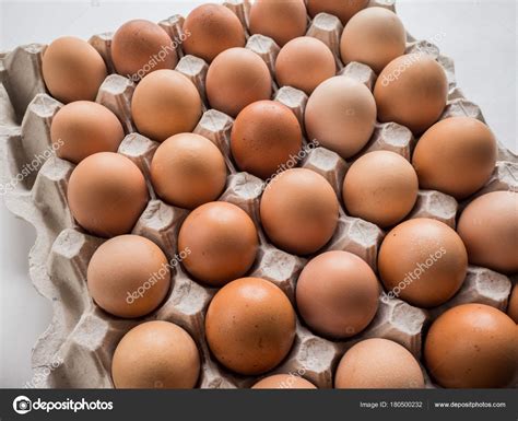 The eggs are already a couple weeks old, so i'd like to use some of them in recipes i can freeze before i leave. A lot of Eggs in the package. — Stock Photo © techiya #180500232