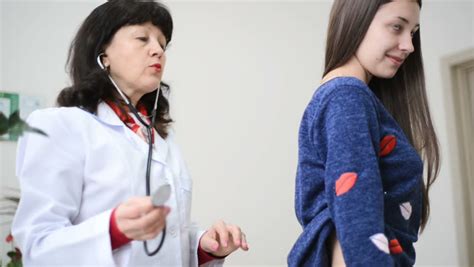 Female Doctor Examining Patient Back With A Stethoscope Stock Footage