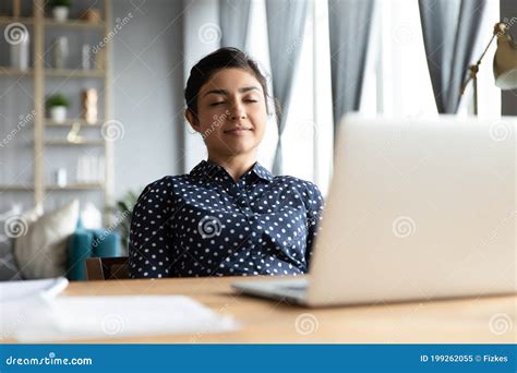 Serene Businesswoman Lean On Office Chair Relaxing With Eyes Closed