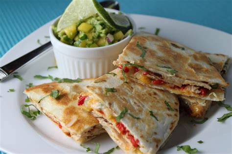 This chicken quesadilla recipe stuffed with monterey jack and cheddar cheese is just the appetizer for a cinco de mayo party or any celebration coming up. Chicken Quesadillas - Recipe