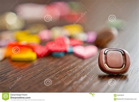 Buttons And Decorative Items Laid Out On Wooden Table In Form Of Stock