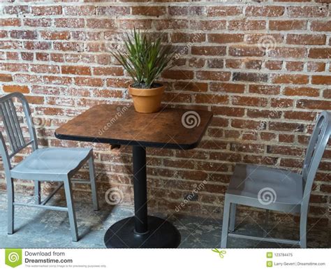Table And Chairs Against A Brick Wall Stock Image Image Of Chairs