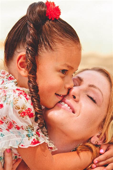 Mom Kissing Her Daughter By Stocksy Contributor Jayme Burrows Stocksy