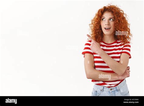 attractive redhead modern lady curly hair look amused curious wonder gazing tempting offer