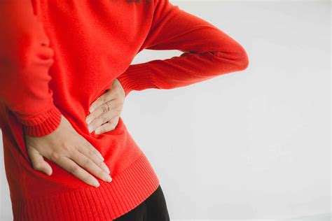 Woman With Lower Back Pain Female Suffering From Backache Copy Space