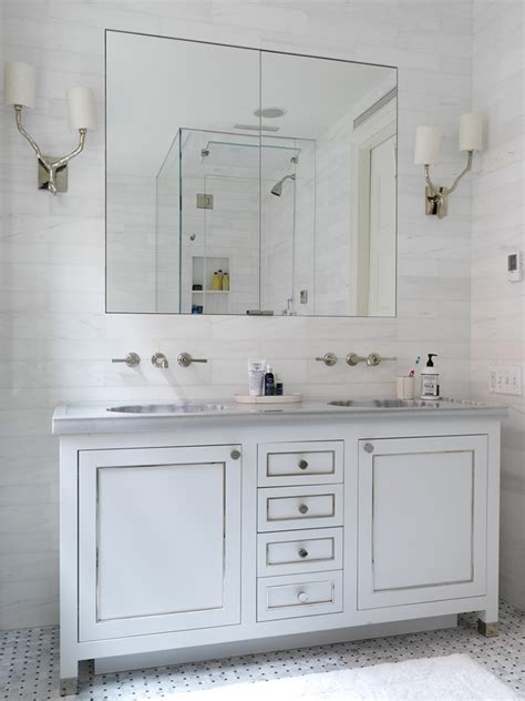 Incredible bathroom with custom bianco dolomiti marble vanity paired with a fantini cafe faucet against a backdrop in black wainscoting clad walls with floating, floor length vanity mirror framed by. Bianco Dolomiti - ABC Stone : ABC Stone