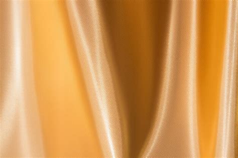 Premium Photo Shiny Yellow Gold Fabric Texture