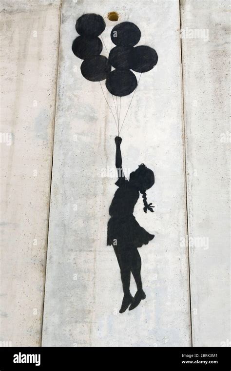 Banksy Girl Flying With Balloons Graffiti On The Separation Wall