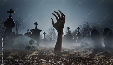 Scary Zombie Hand In Cemetery Or Graveyard Sticking Out Of The Ground