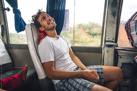 Young Man Traveling On A Bus While Backpacking Del Colaborador De Stocksy Alejandro Moreno De