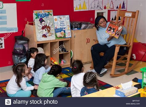 Preschool Classroom Preschool Teacher Reading A Book To
