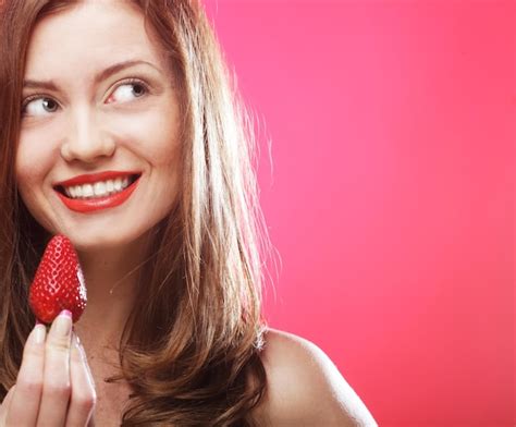 Premium Photo Girl Eating Strawberries