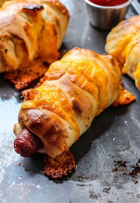 Yep, that's basically a hot dog pie you're looking at. Cheddar Garlic Soft Pretzel Wrapped Hot Dogs - Layers of Happiness