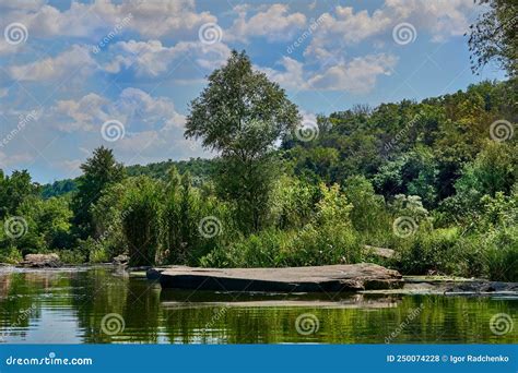 Calm View With A Quiet Backwater Of The River With Large Stones And