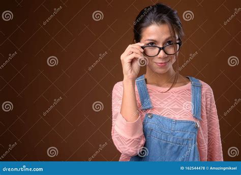 Portrait Of Beautiful Multi Ethnic Nerd Woman With Eyeglasses Stock