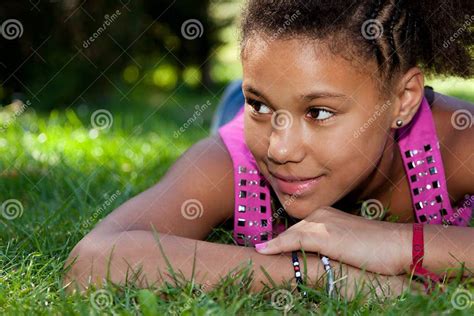 Young Black Teenage Girl Lying On The Grass Stock Image Image Of