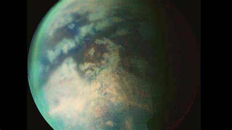 Titan Saturns Moon With Hydrocarbon Lakes Under A Dense Atmosphere