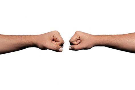 Closeup Shot Of Two Young Man Bumping Fists Over White Background Stock