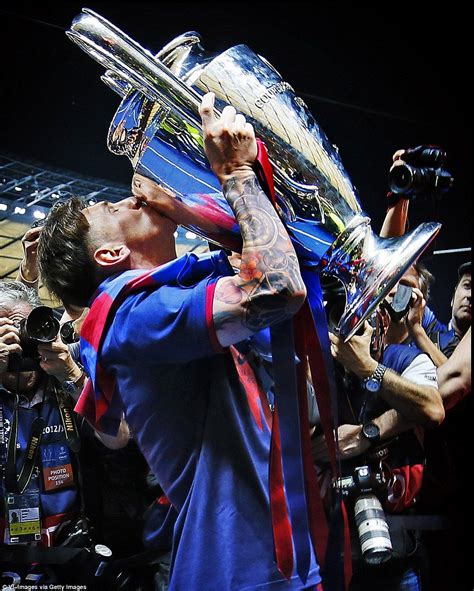 Messi Kisses The Champions League Trophy After Winning It For The