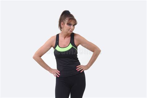 Attractive Middle Aged Woman In Sports Gear Posing Stock Photo Image