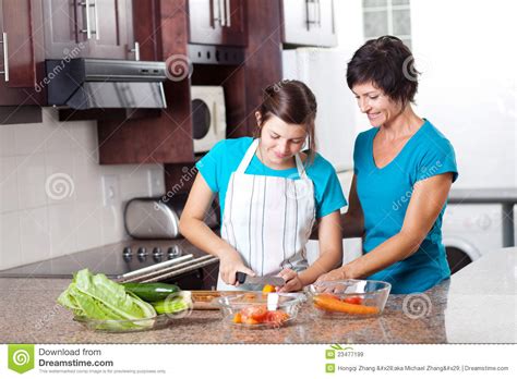 Mother Teaching Teenage Daughter Cooking Stock Image Image Of Aged
