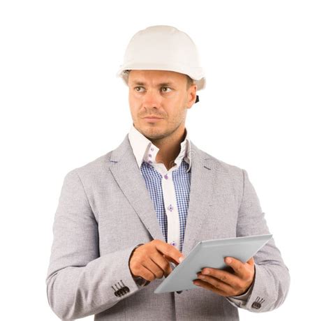 Architect Wearing Hard Hat Inside Unfinished Home Stock Photo Image