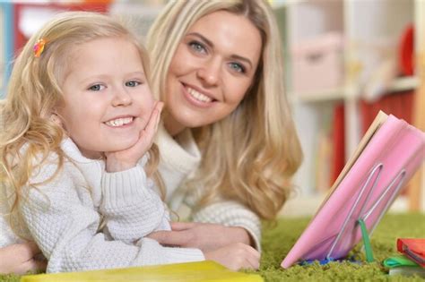 Premium Photo Portrait Of A Mother With Little Daughter Reading Book