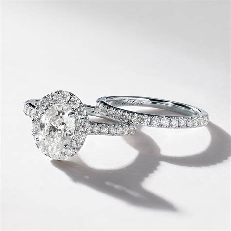 This Neil Lane Engagement Ring Features A Stunning Oval Diamond Halo Wedding Rings Teardrop