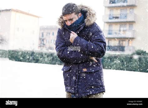Portrait Of Man Feeling Very Cold And Shivering In Winter Stock Photo Alamy