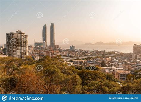 Xiamen City Skyline With Modern Buildings Old Town And Sea At Dusk