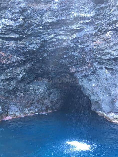 Cave And Waterfall In Napali Coast Mountains And Cliffs Seen From