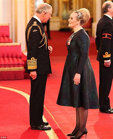 adele collects her mbe from prince charles daily mail online