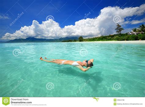 Woman In Bikini Relaxing Lying On The Water Royalty Free