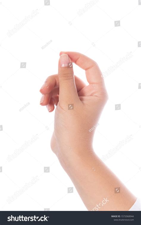 Womans Hand Measuring Invisible Items On Stock Photo 1572068944