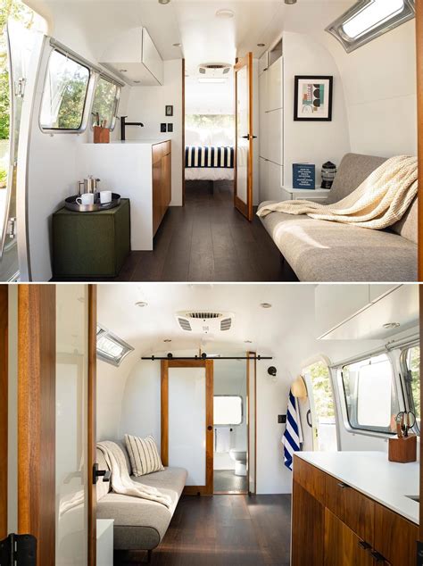 A Remodeled Airstream Trailer With A Modern Interior That Includes A