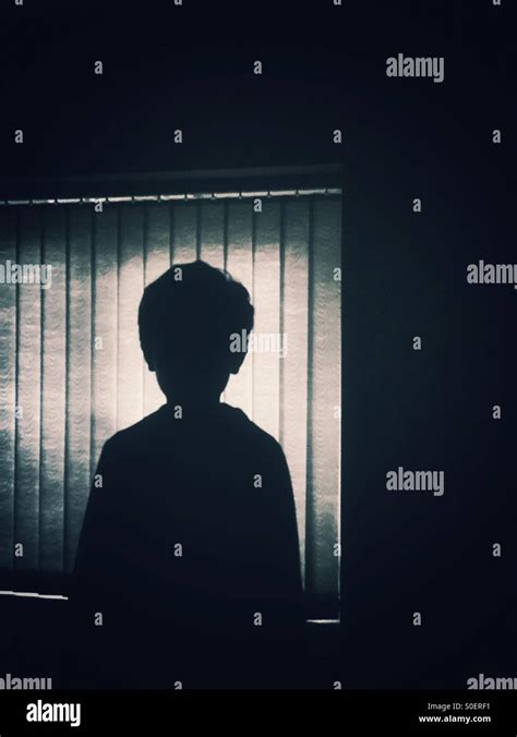 Silhouette Of A Little Boy By The Window Stock Photo Alamy