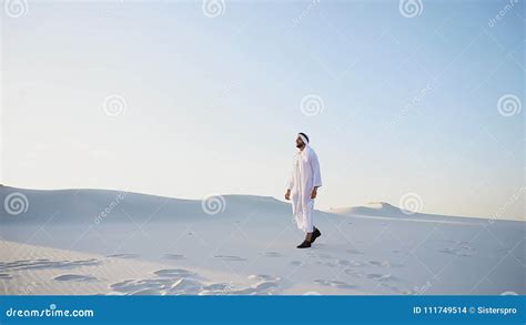 Confident Guy Arab Walks In Middle Of White Desert And Enjoys L Stock