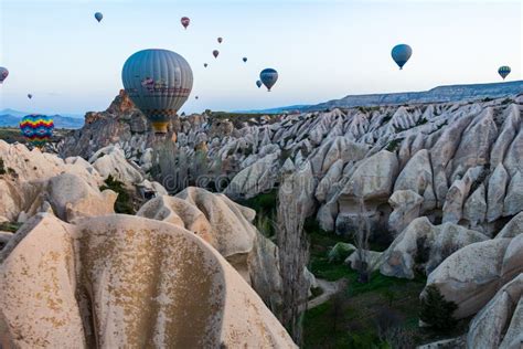 Hot Air Balloons Fly Between Fairy Chimneys In Cappadocia Editorial