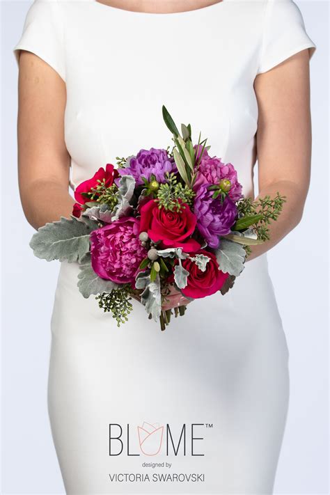 This Vivid Bouquet Features A Grand Array Of Hot Pink Roses Peonies