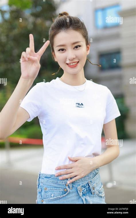 Chinese Actress Qiao Xin Also Known As Bridgette Qiao Poses Before