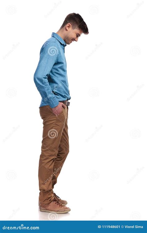 Side View Of A Casual Man Looking Down At Something Stock Image Image