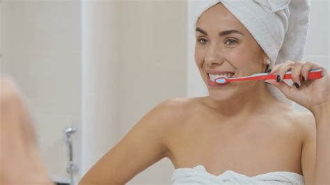 Woman Brushes Her Teeth In The Bathroom Stock Video Footage Sbv