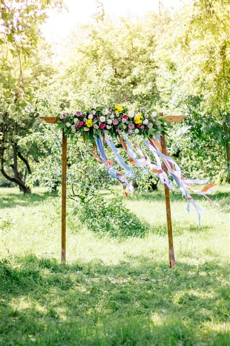 Beautiful Wedding Arch With Flowers On Forest At Summer Day Stock
