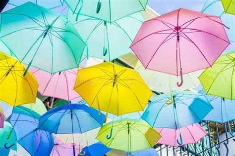 Hanging Colorful Umbrellas On The Street And Blue Sky Stock Photo