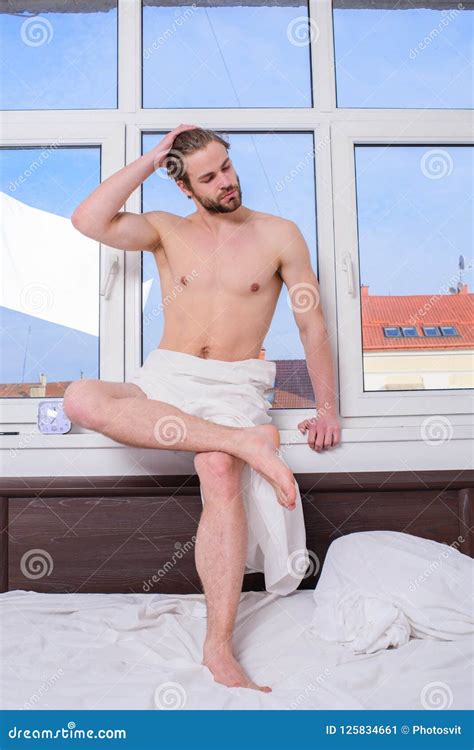 Feel Divine Concept Bed With White Bedclothes And Nude Torso Man Macho Relaxing In Morning