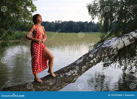 Pretty Seminude Woman In Red Dress On The Lake Stock Photo Image Of