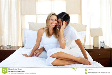 Affectionate Lovers Embracing On Bed Stock Image - Image: 12811757