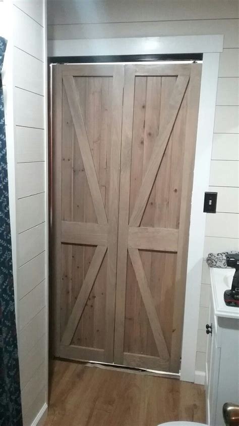 If there is one thing i have learned about diy is you don't have to settle for boring spaces. DIY bifold barn door | Bifold barn doors, Barn door, Decor